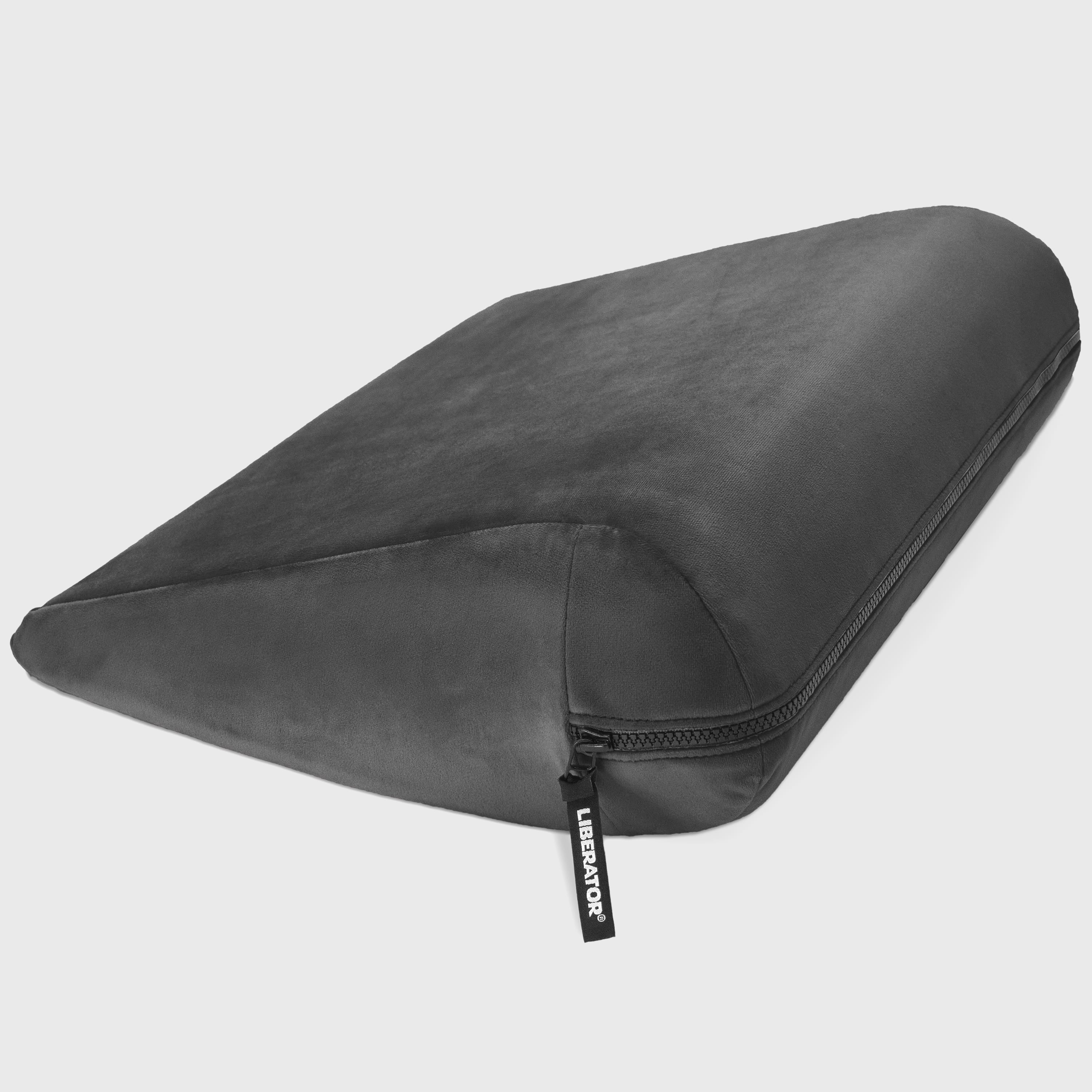 Black wedge pillow with zipper on a white background