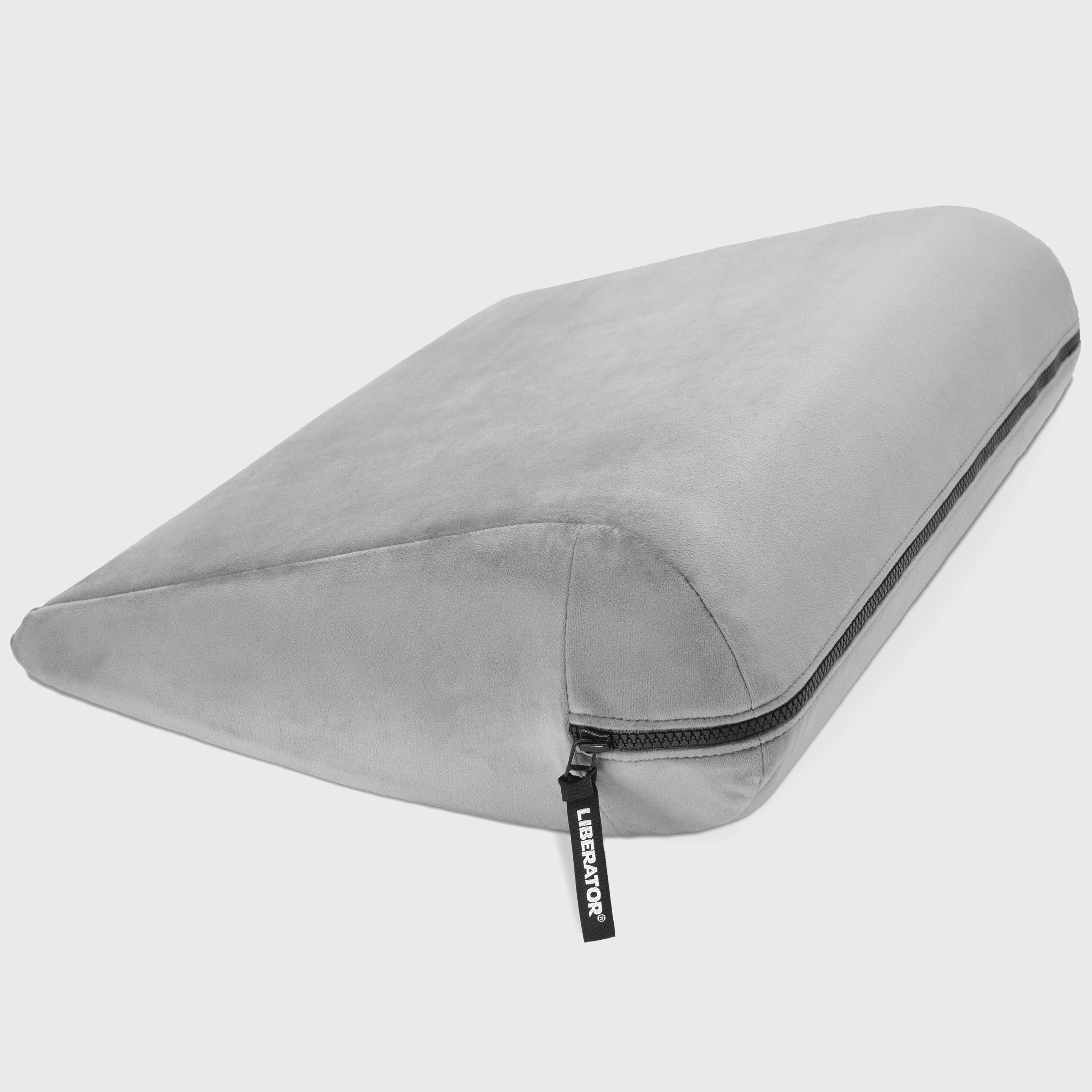 Gray travel pillow with a zipper on a white background