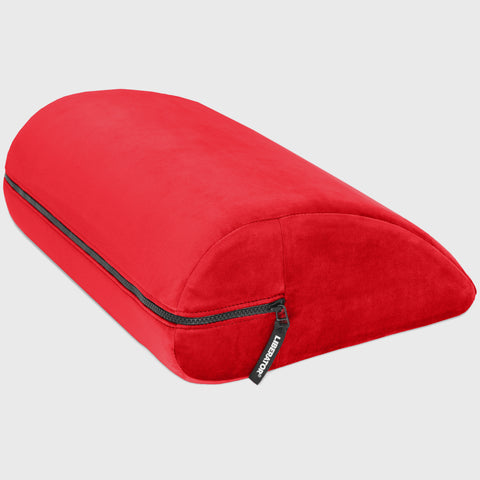 Red travel pillow with a zipper on a light gray background
