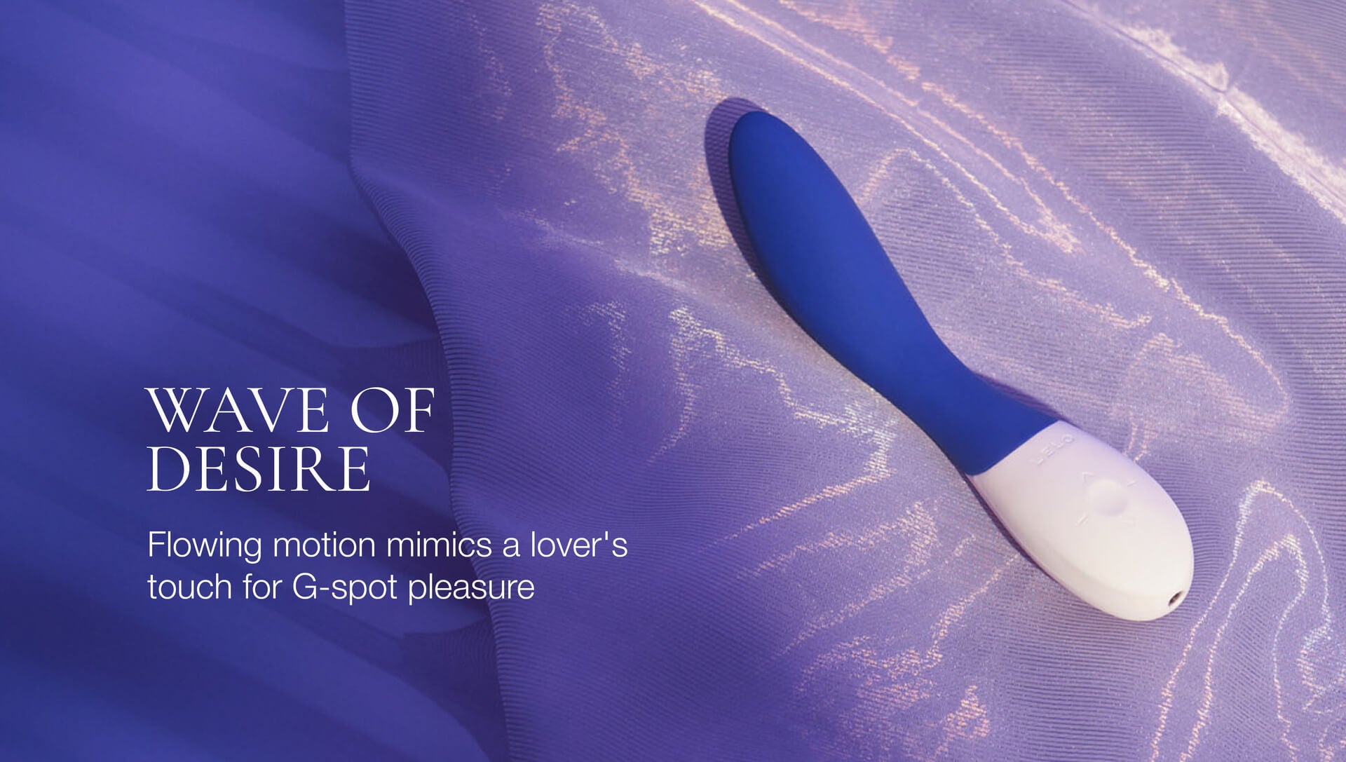 Blue and white G-spotpleasure device on a textured purple surface with 'Wave of Desire' text.