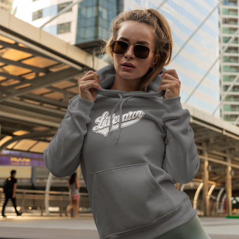 Woman showing off her Liberator Baseball Logo Hoodie, grey