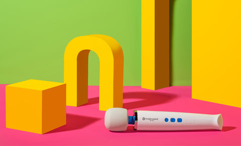 Magic wand mini white color with a colorful abstract background