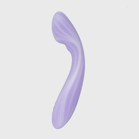 Purple curved vibrator on a light gray background