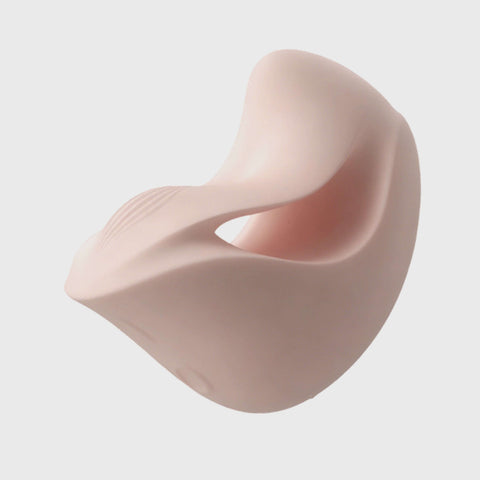 Pink silicone breast form on a light gray background
