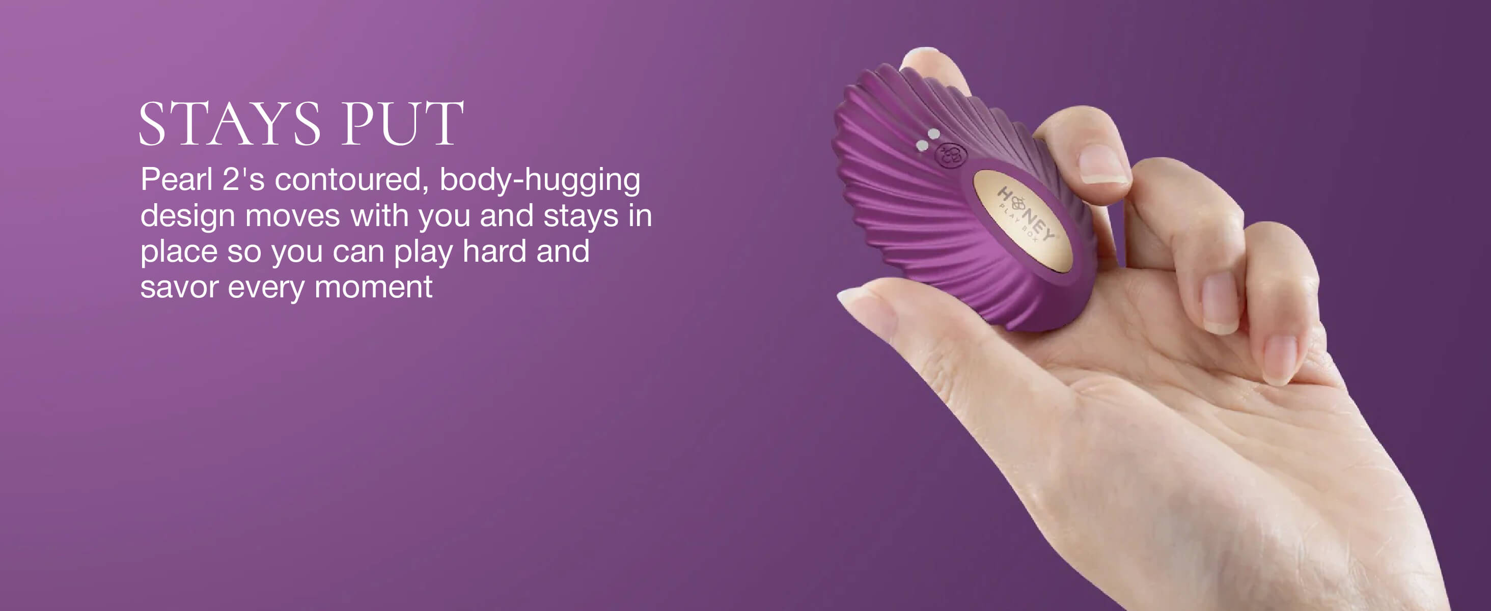 Purple wearable vibrator held in a hand with promotional text on a purple background