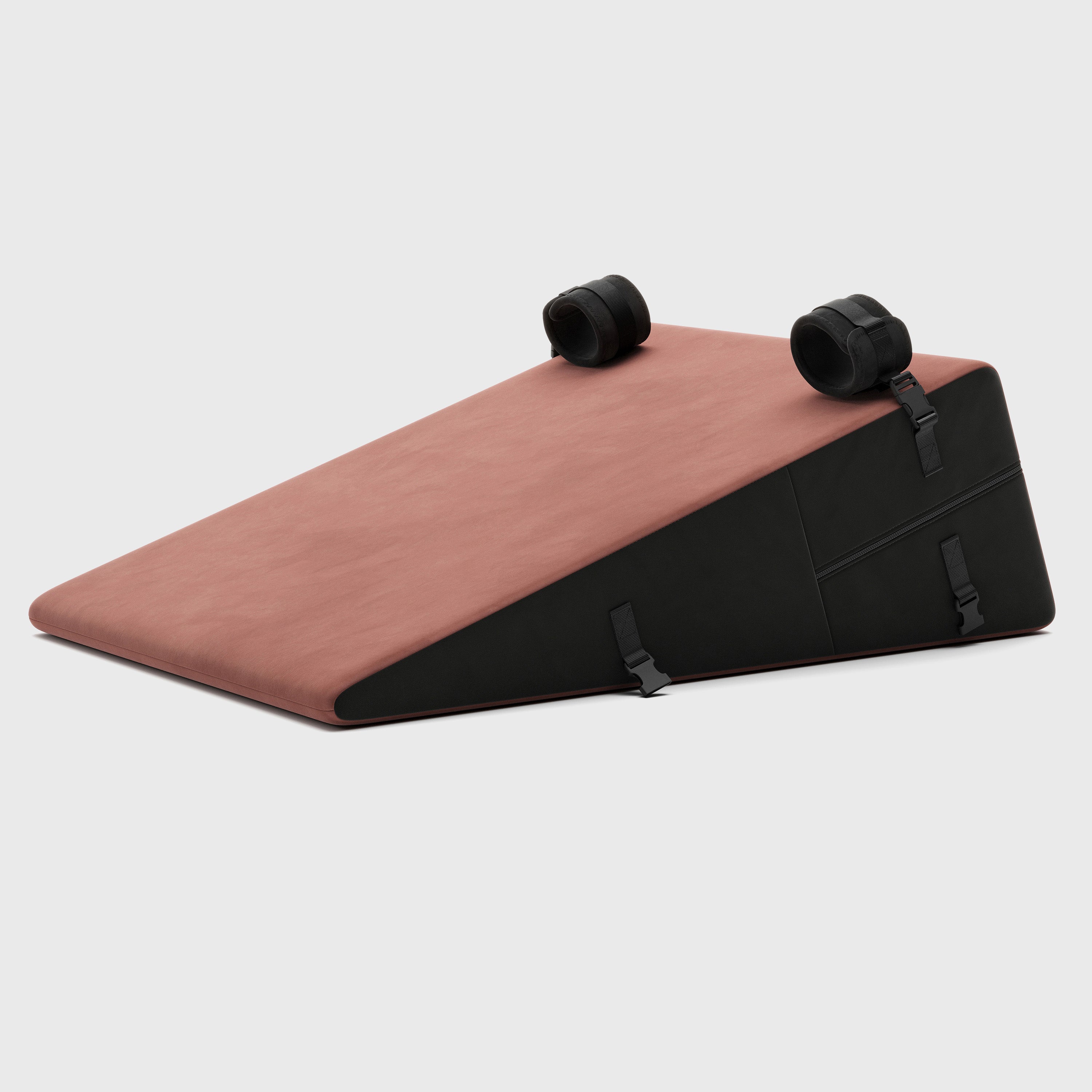 Triangular ramp with pink top and black sides on a white background