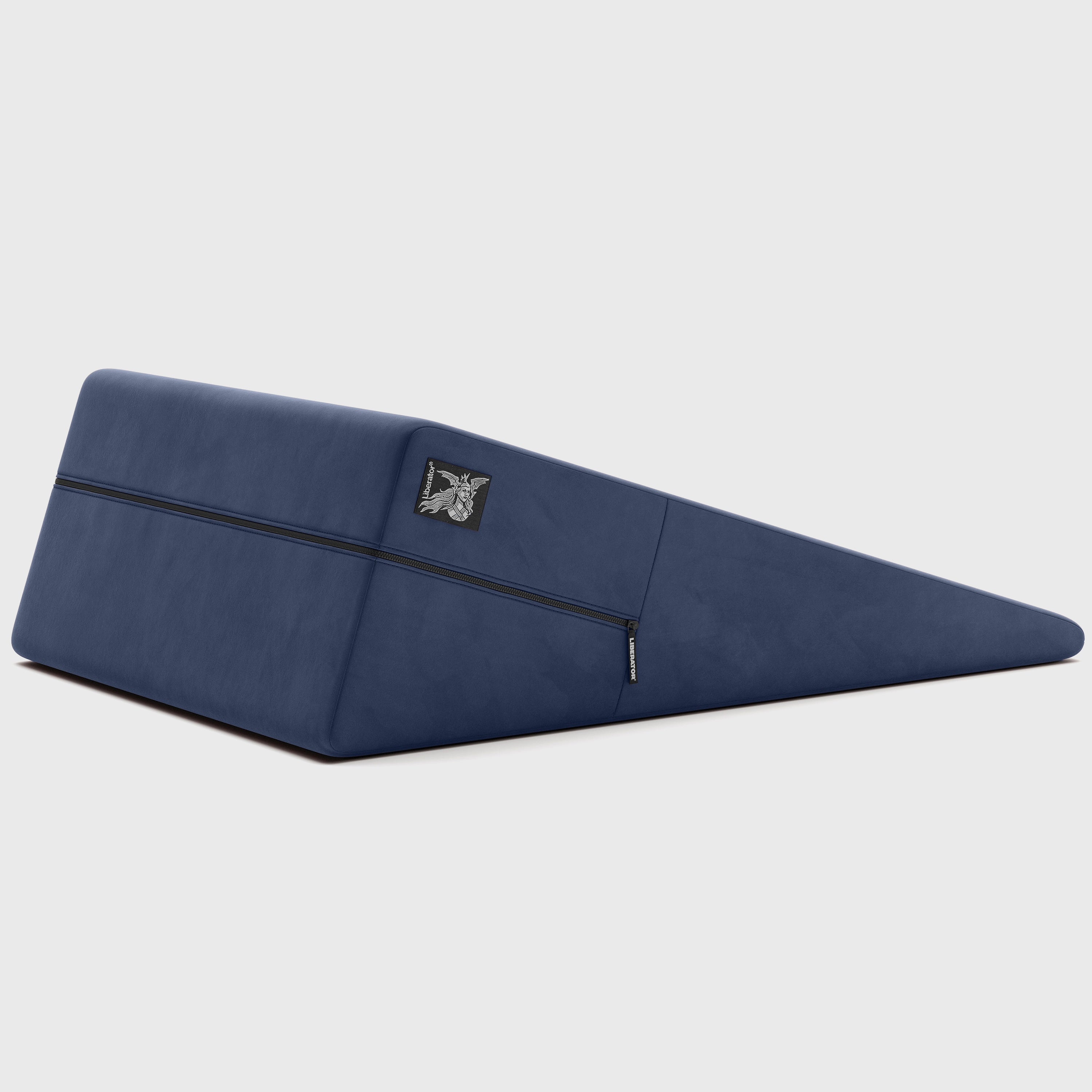 Navy ramp pillow with a brand logo on a light gray background