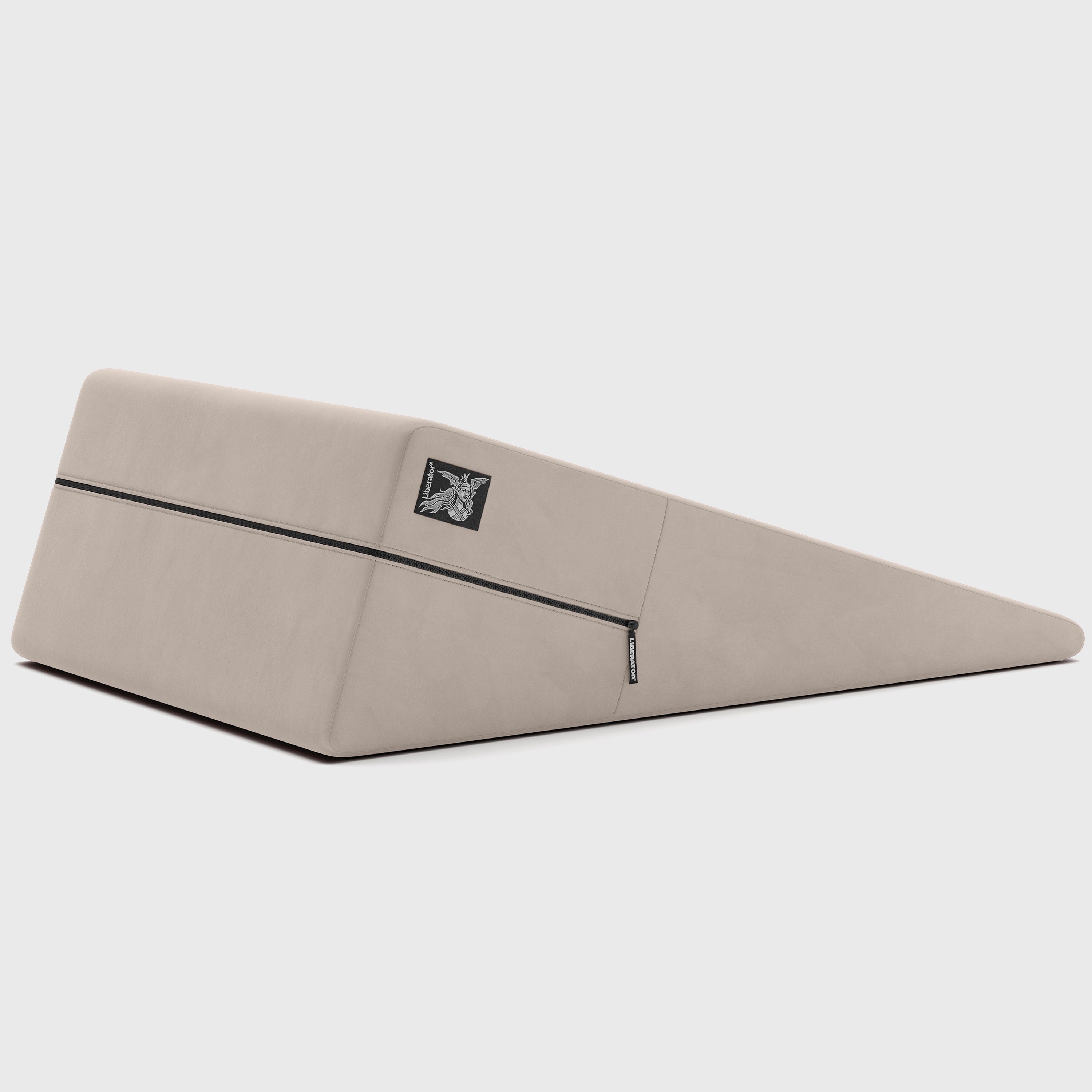 Beige ramp pillow with a brand logo on a light gray background