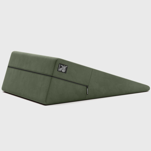 Teal ramp pillow with a brand logo on a light gray background