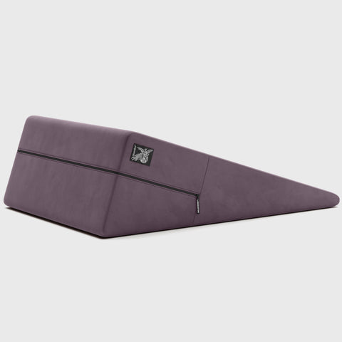 Purple ramp pillow with a brand logo on a light gray background