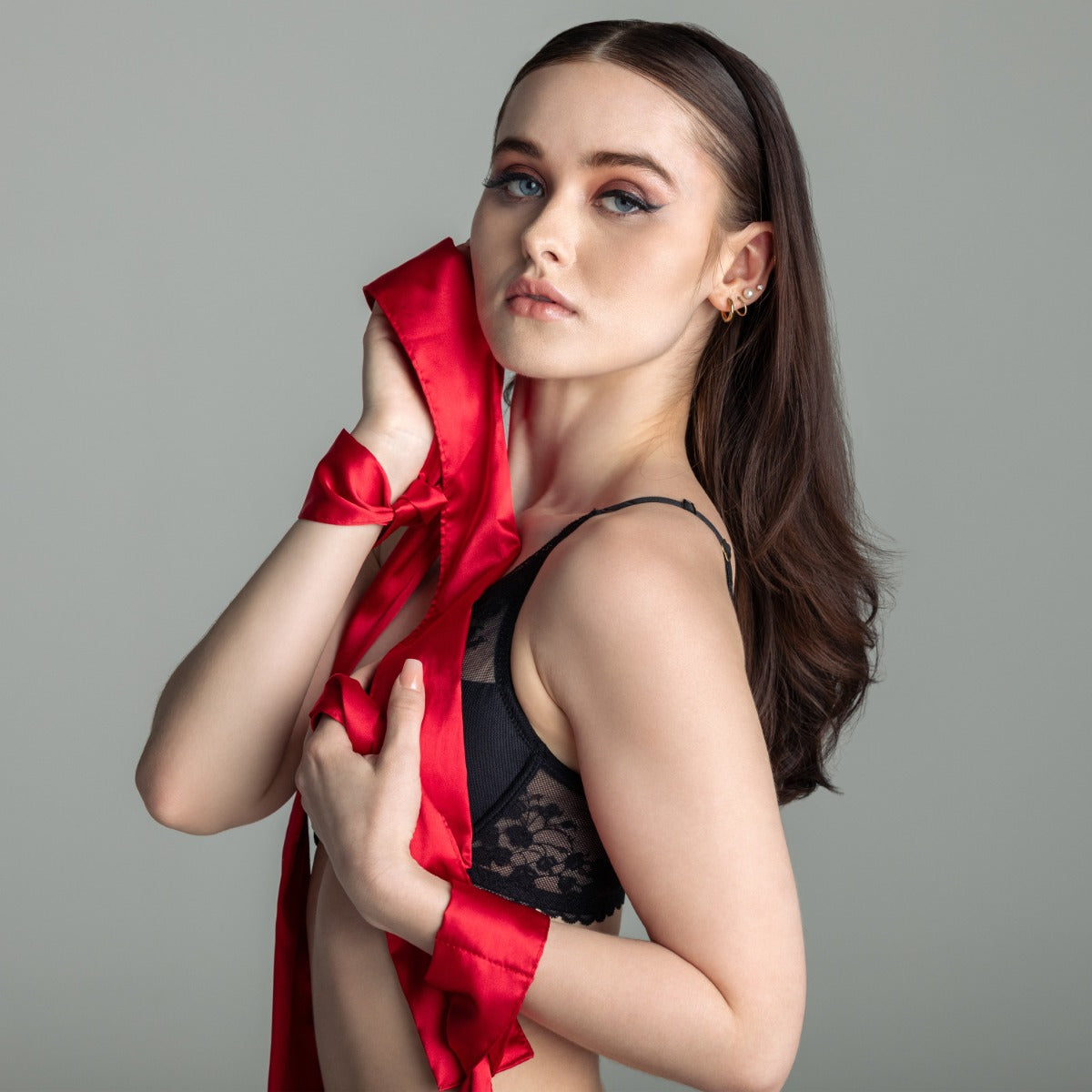Woman with silky tie ups in red