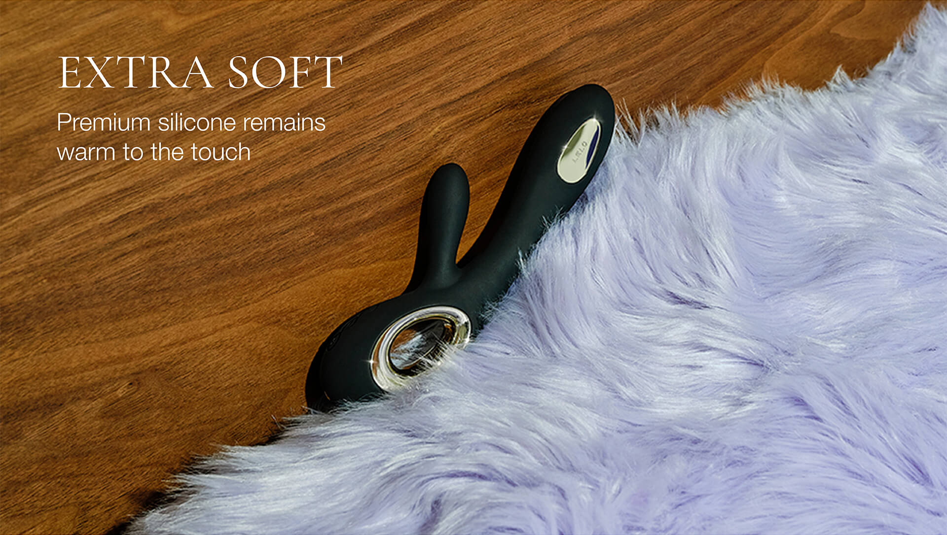 Black silicone product on a wooden surface with text 'EXTRA SOFT' and 'Premium silicone remains warm to the touch'.