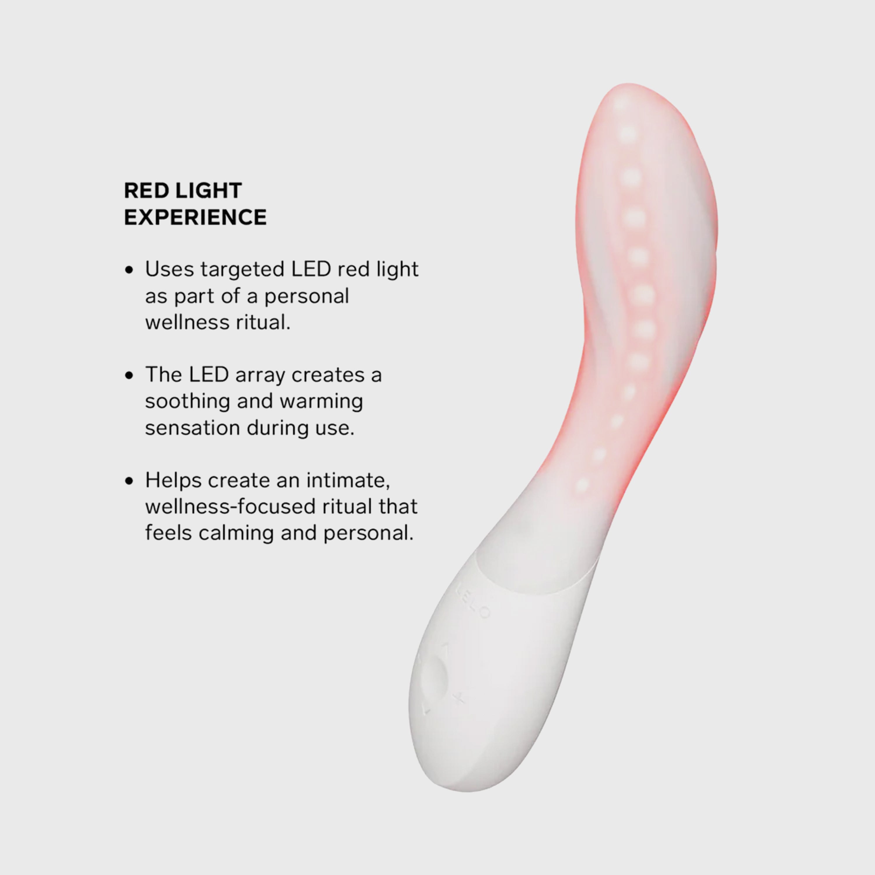 An ergonomic personal wellness massager with a white base and a translucent pink silicone head, shown on a light gray background next to descriptive text about its red light experience.