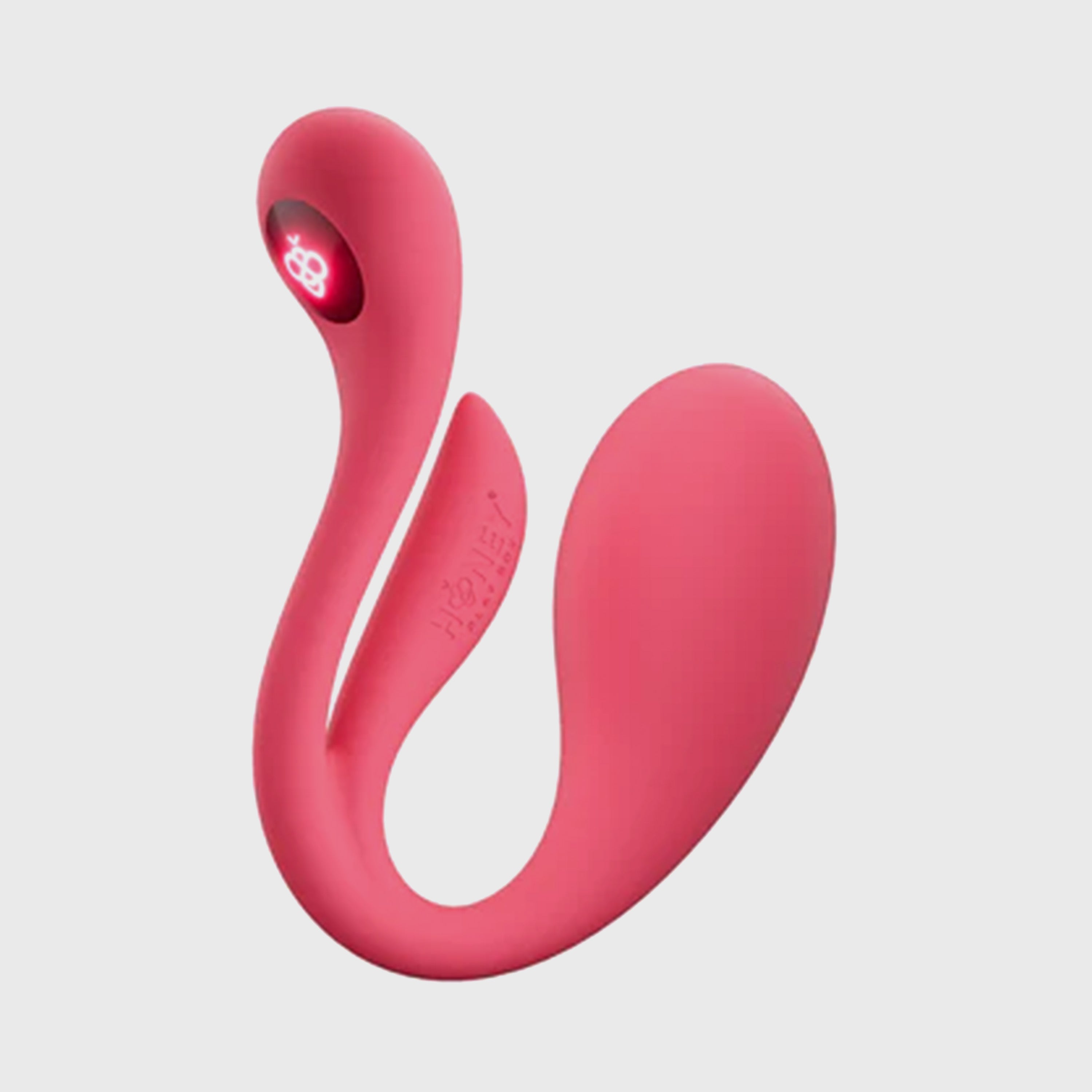 Pink silicone vibrator on a light gray background