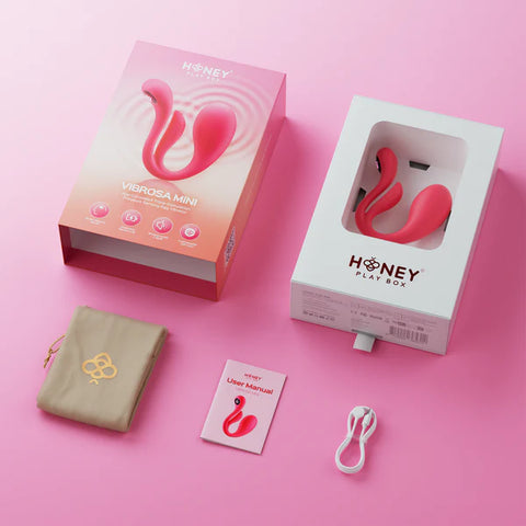 Honey Play Box product with packaging, user manual, and accessories on a pink background