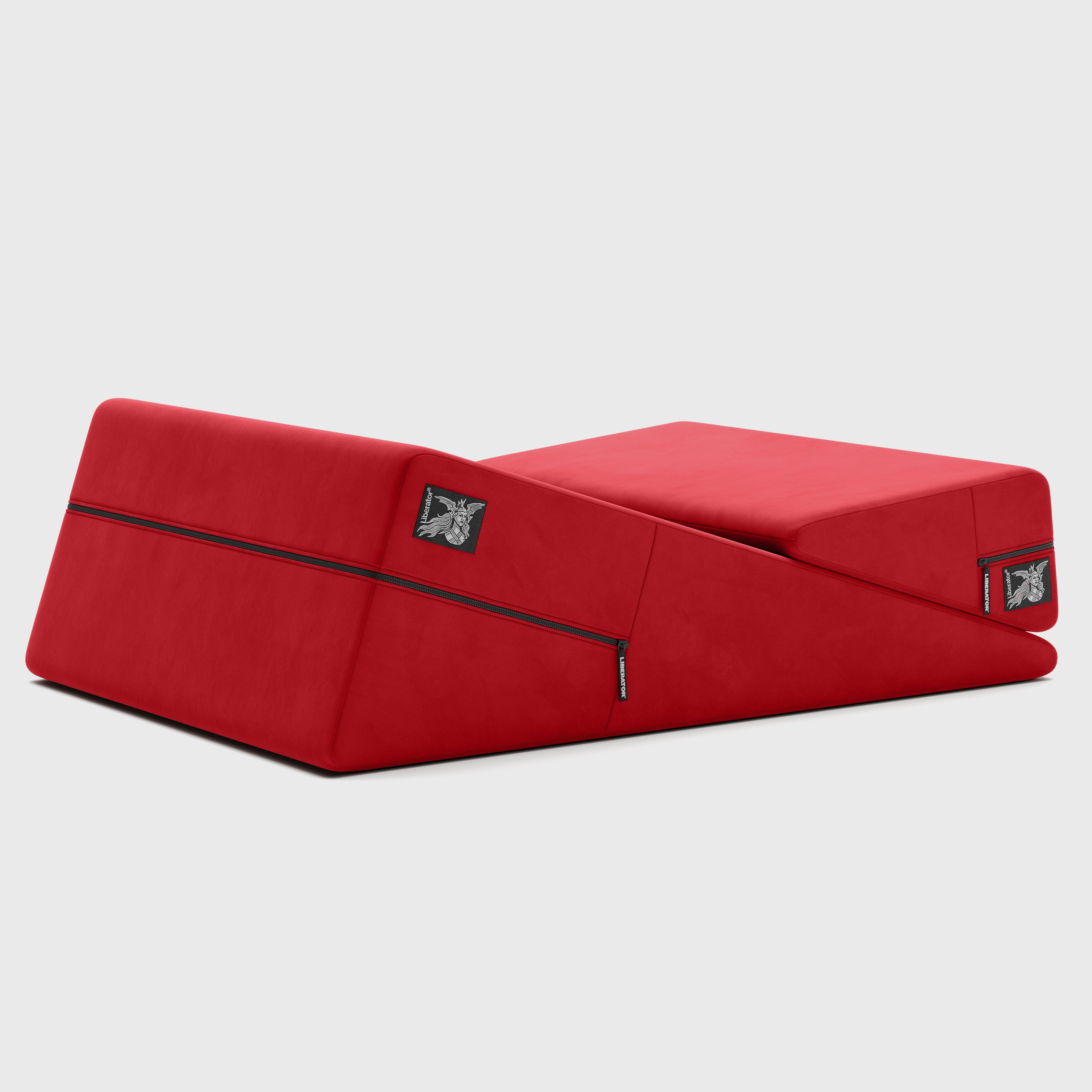 Red wedge pillow on a light gray background