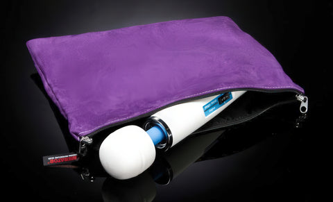 Purple pouch with a white object inside on a black background