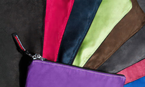 Colorful fabric pouches on a black background
