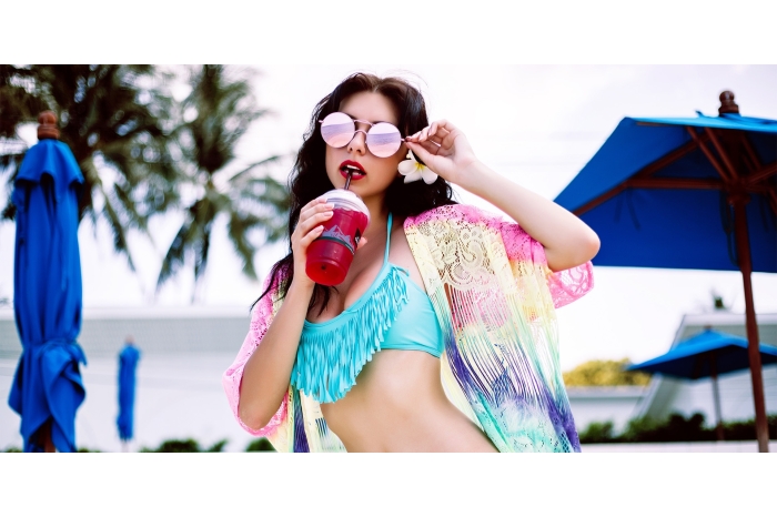 Sultry woman on summer vacation