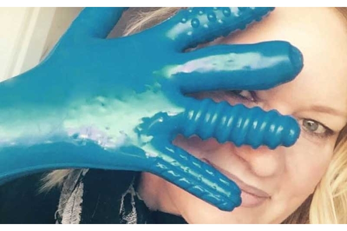 Woman wearing latex sex glove