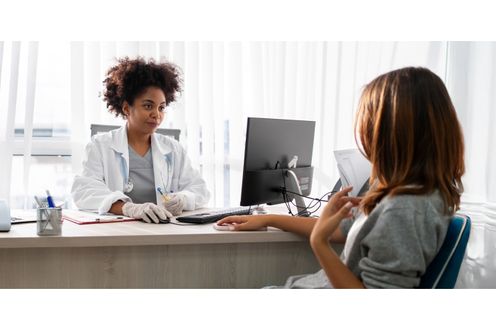 Woman speaking with her doctor in the office