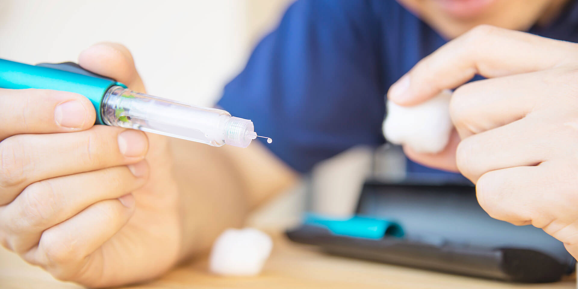 Man holding medication syringe