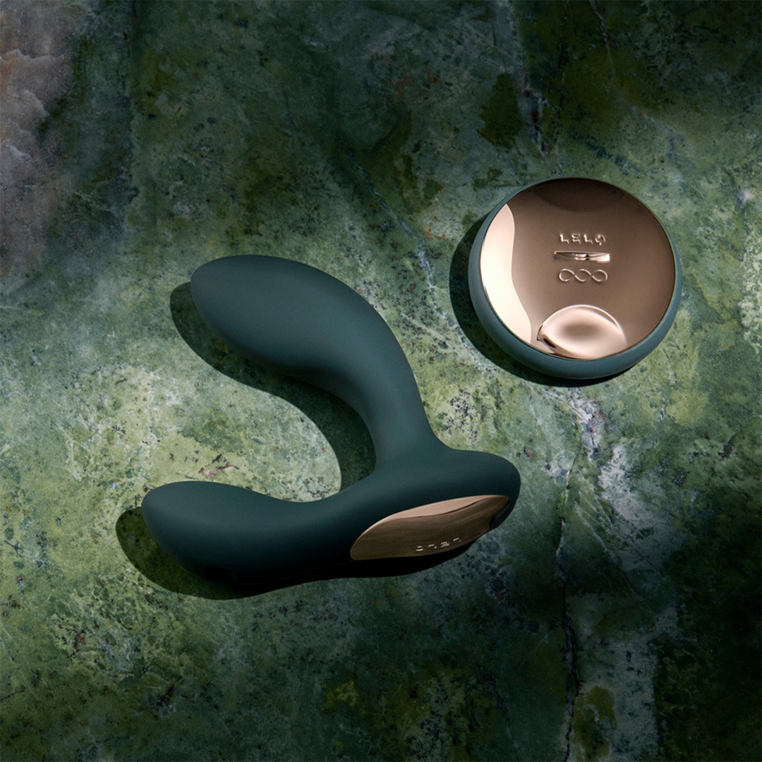 lifestyle photo of LELO Hugo 2 prostate massager with remote on marbled stone background