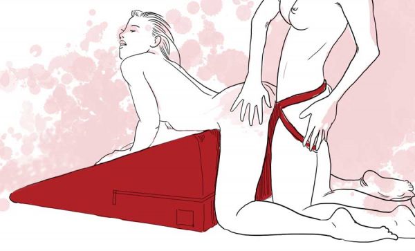 Lesbian strap-on sex using Liberator Ramp sex wedge